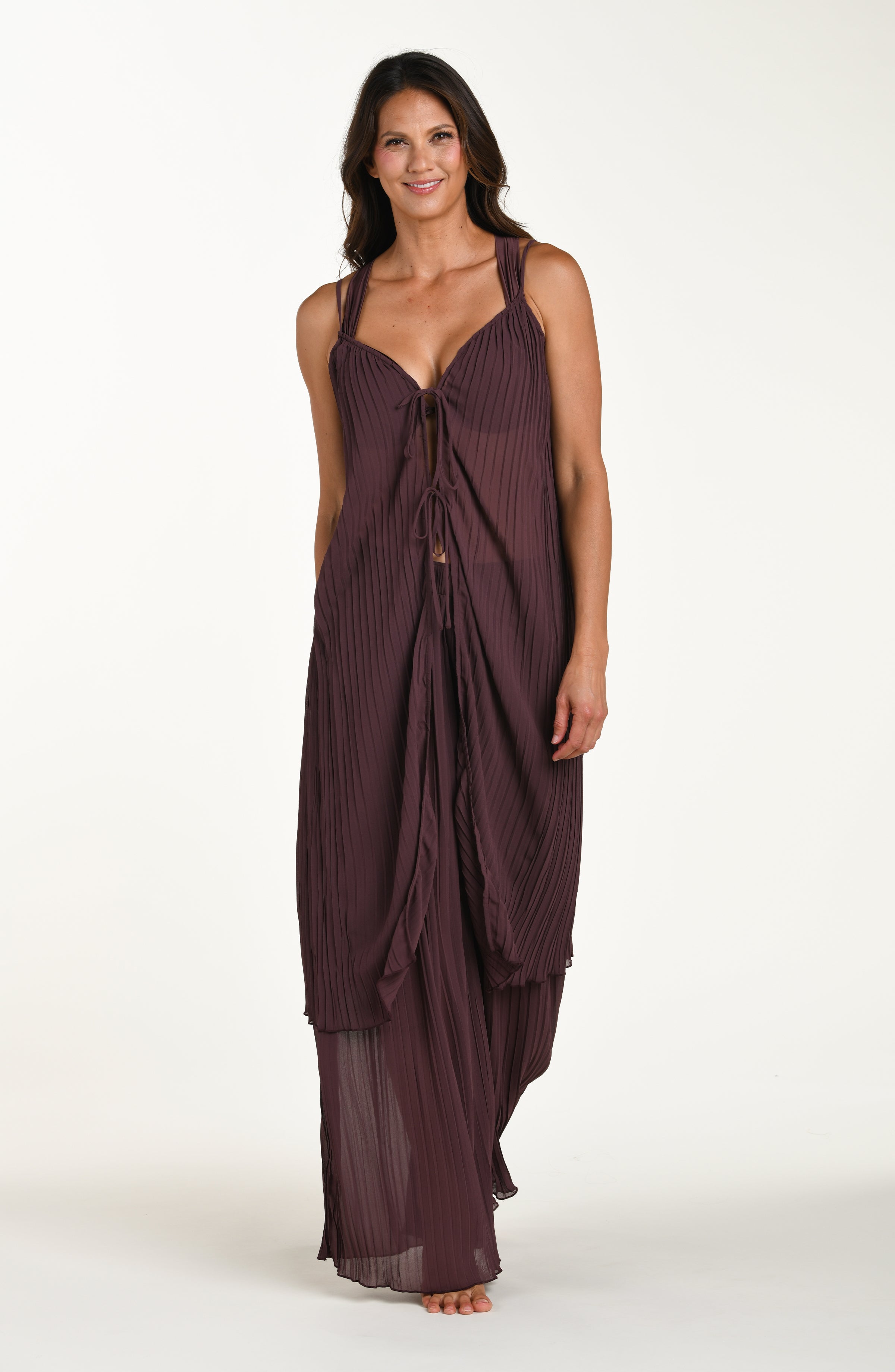 Woman wearing a burgundy evening gown on a white background