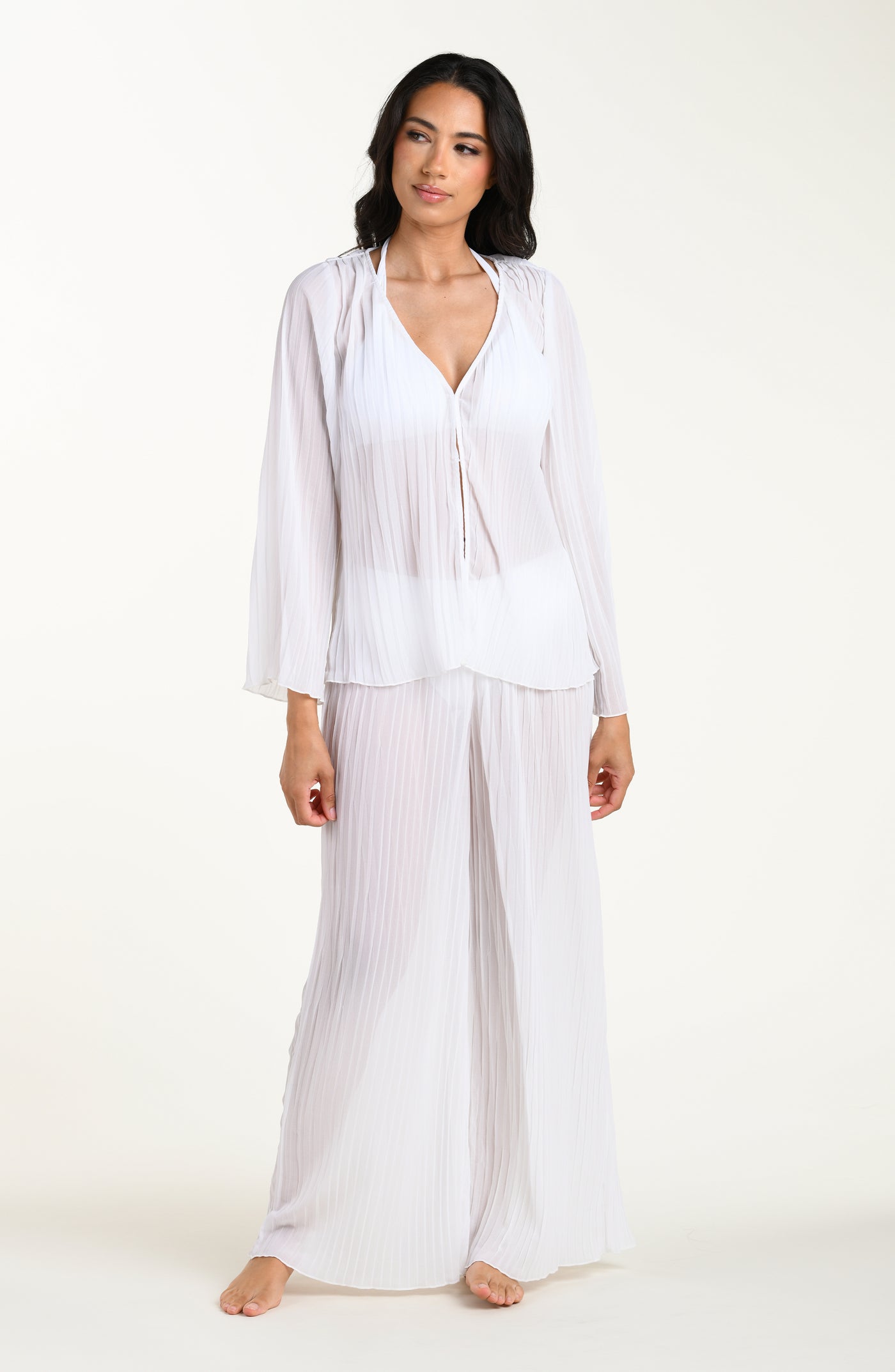 
                  
                    Woman wearing a white outfit on a white background
                  
                