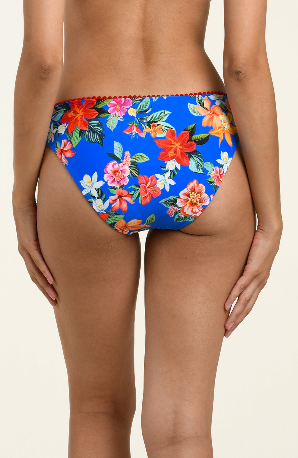 Blue floral bikini bottom on a beige background