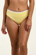 Yellow patterned bikini bottom on a beige background