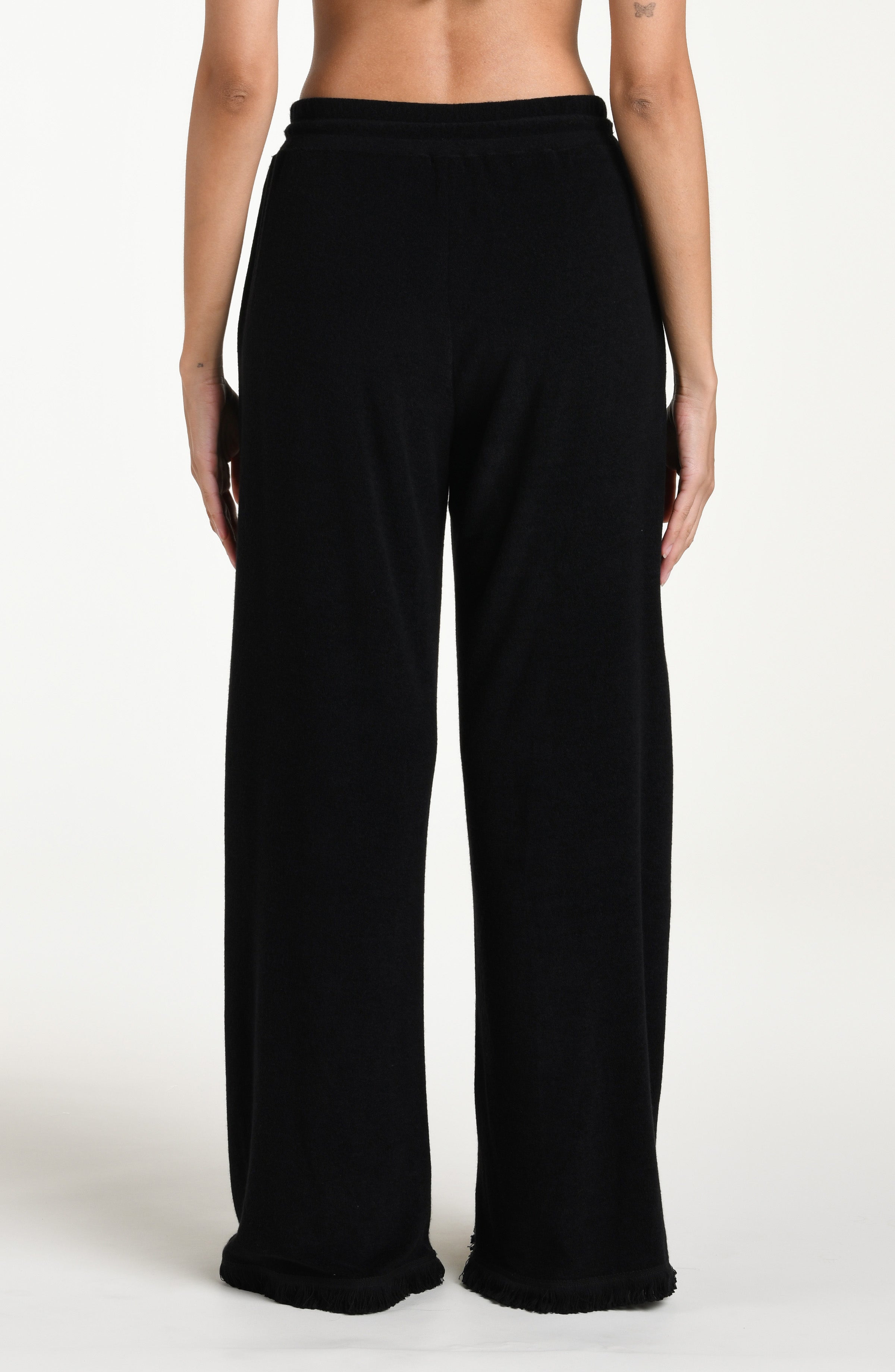 Black wide-leg beach pants with drawstring waist against a white background