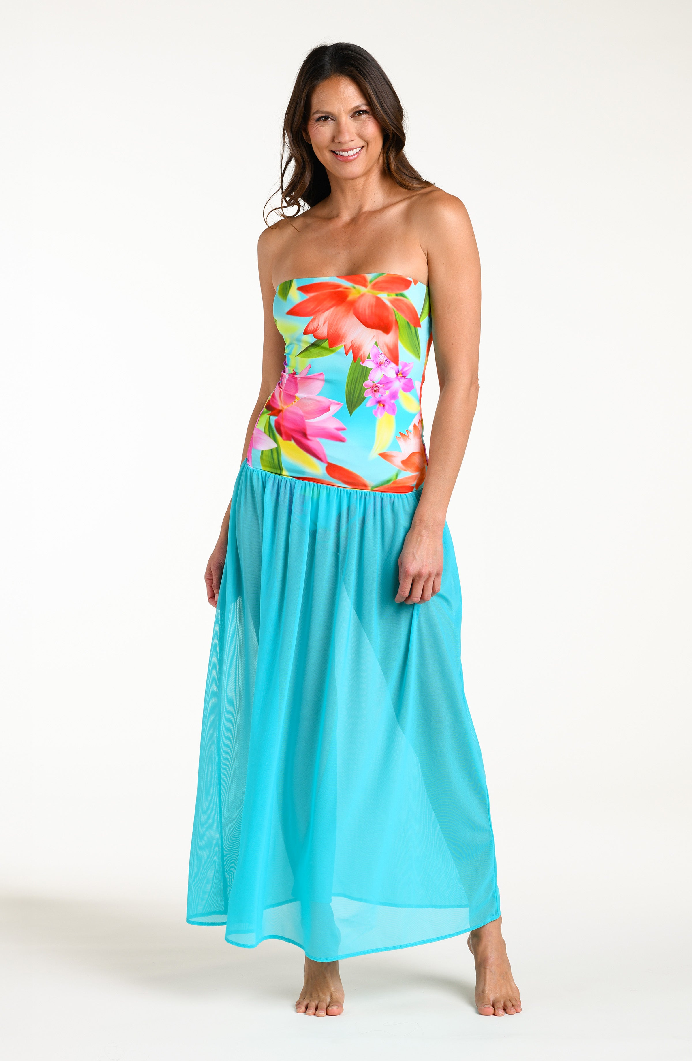 Woman wearing a turquoise convertible maxi dress cover up against a white background