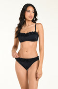 Woman wearing a black bikini top with floral details and a matching bikini top on a white background