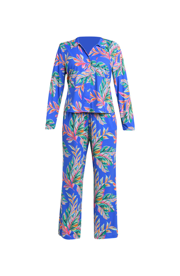 Colorful tropical leaf patterned pajama set on a white background