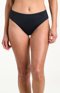 Person wearing black mid-waisted bikini bottoms on a white background
