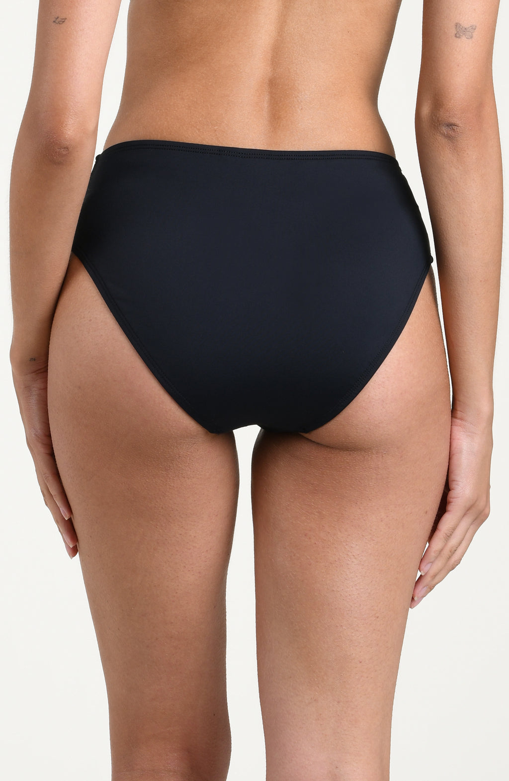 Black mid-waisted bikini bottoms with a gold clasp against a white background