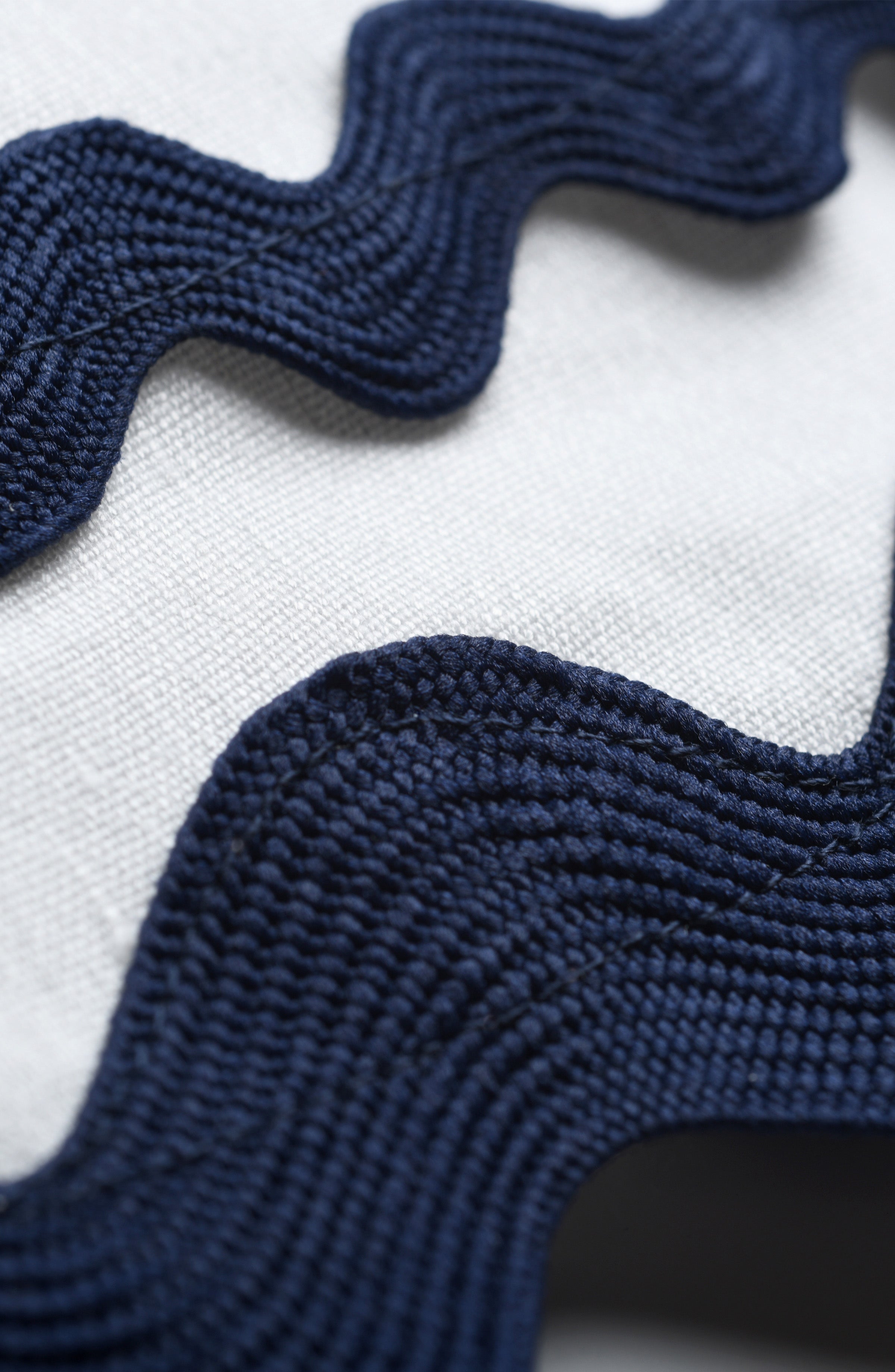 Close-up of blue textured fabric on a white background