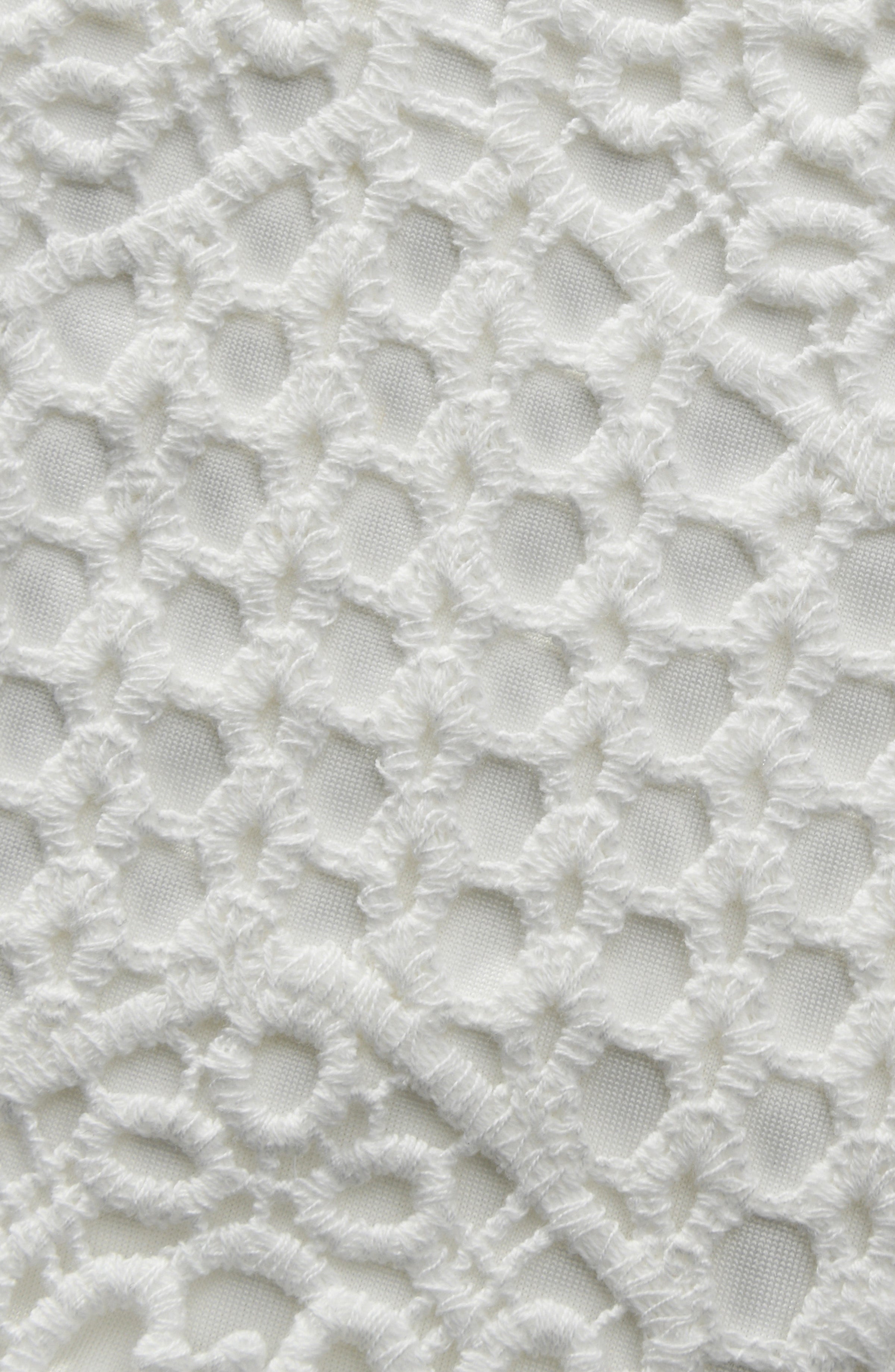 Close-up of a textured white surface with a lattice pattern
