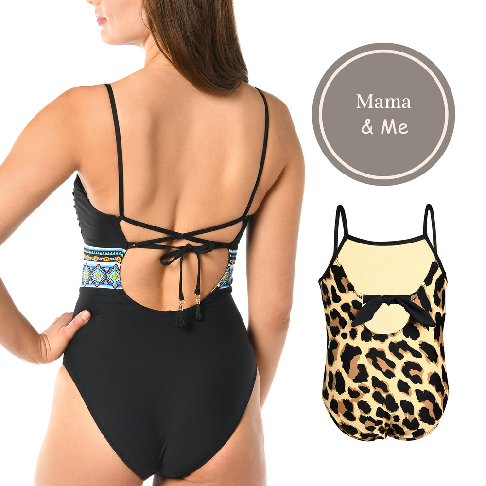 
                  
                    Toddler is wearing a black and tan leopard printed high neck one piece from our Mama and Me Running Wild collection.
                  
                