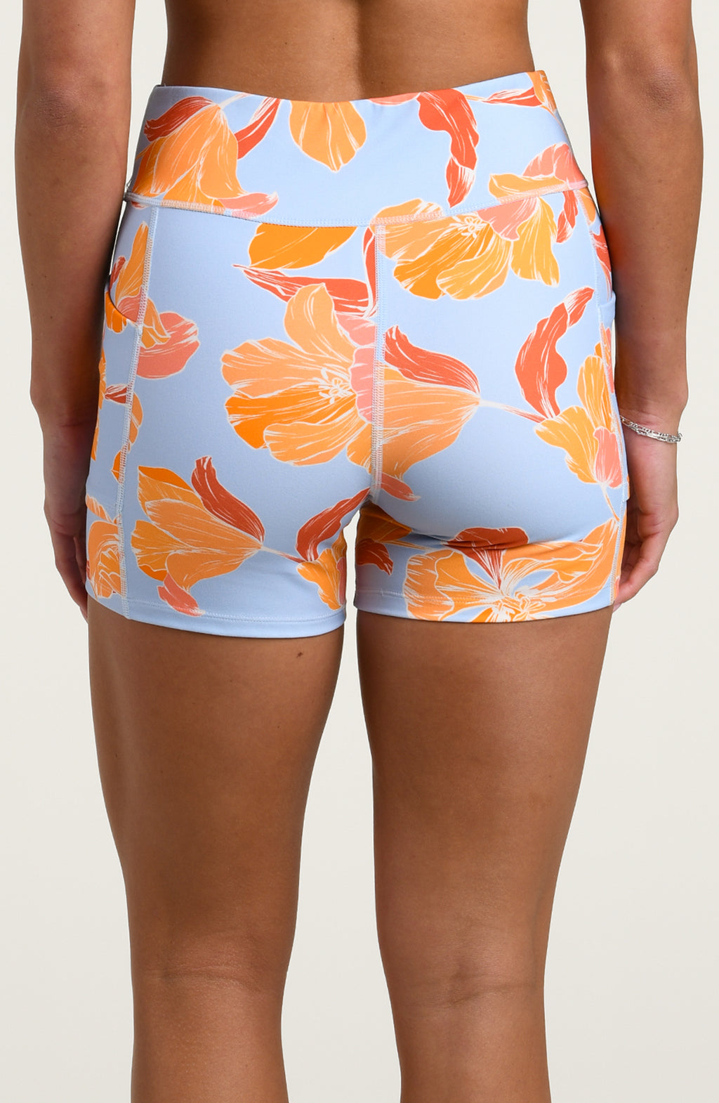 Floral patterned biker shorts on a plain background