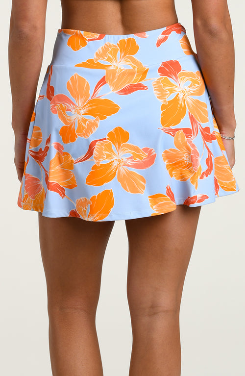 Floral patterned active skort against a plain background