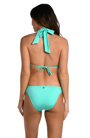 Model is wearing a solid seafoam green colored halter triangle bikini top from our Wanderlust Solids collection.