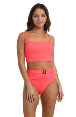 Model is wearing a solid watermelon colored midkini top from our Wanderlust Solids collection.