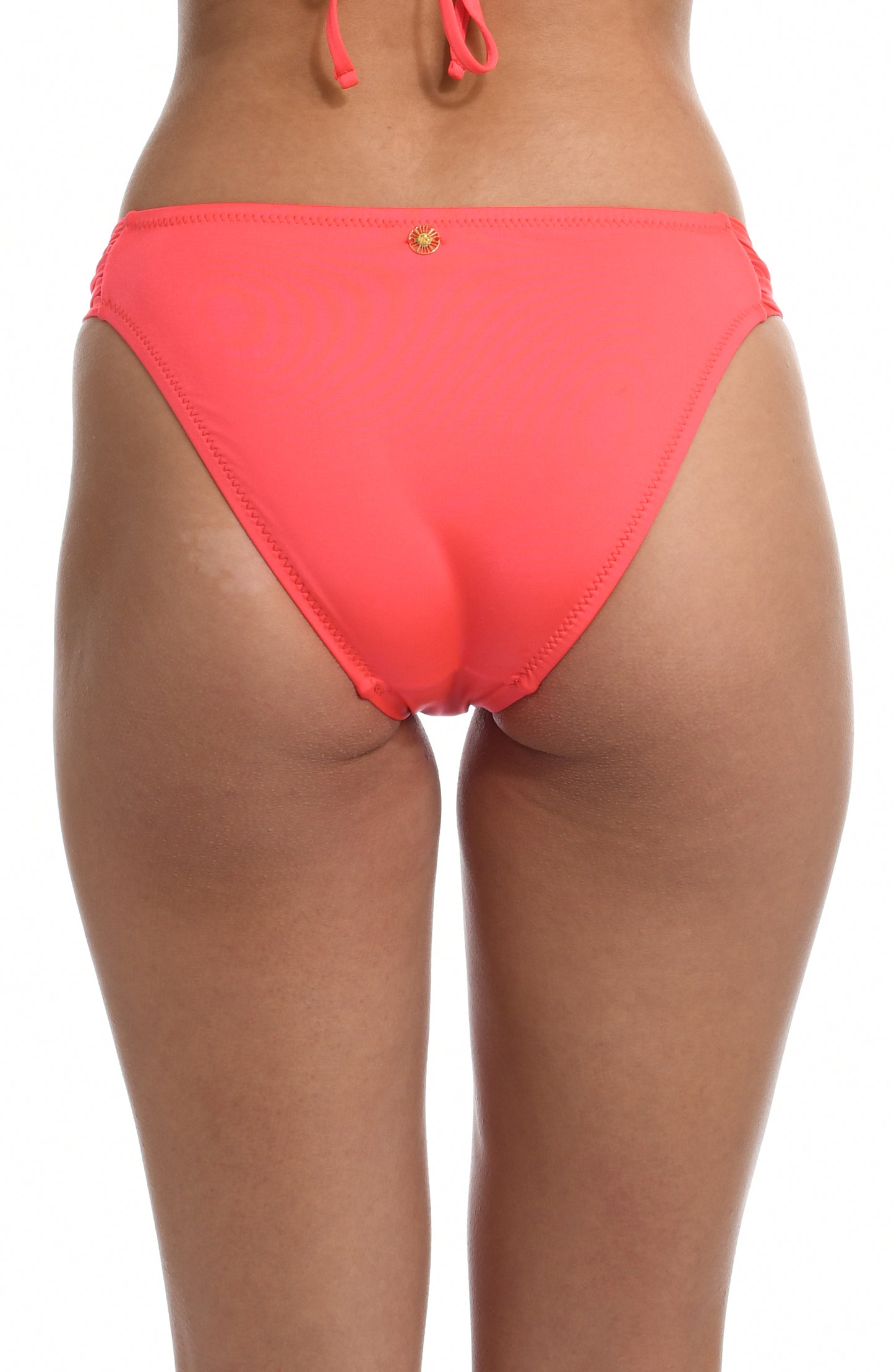 Model is wearing a solid watermelon colored side tie hipster bikini bottom from our Wanderlust Solids collection.