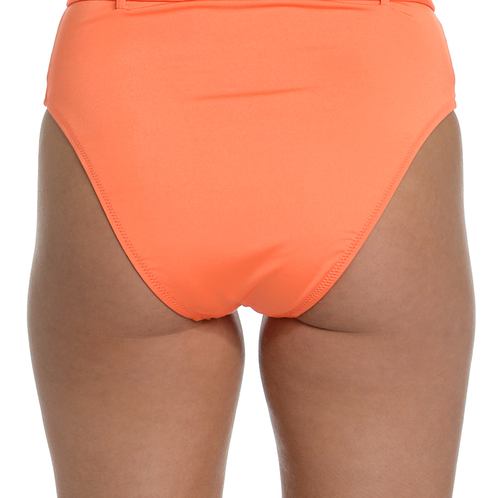 
                  
                    Model is wearing a solid bright coral colored high waist bikini bottom from our Wanderlust Solids collection.
                  
                