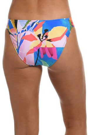Model is wearing a blue multicolored floral printed side shirred hipster bottom from our Feelin Fine Floral collection.