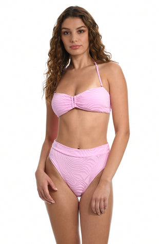 Model is wearing a light pink bandeau bikini swimsuit top with an all over gentle swirl print from our Groovy Swirl collection.