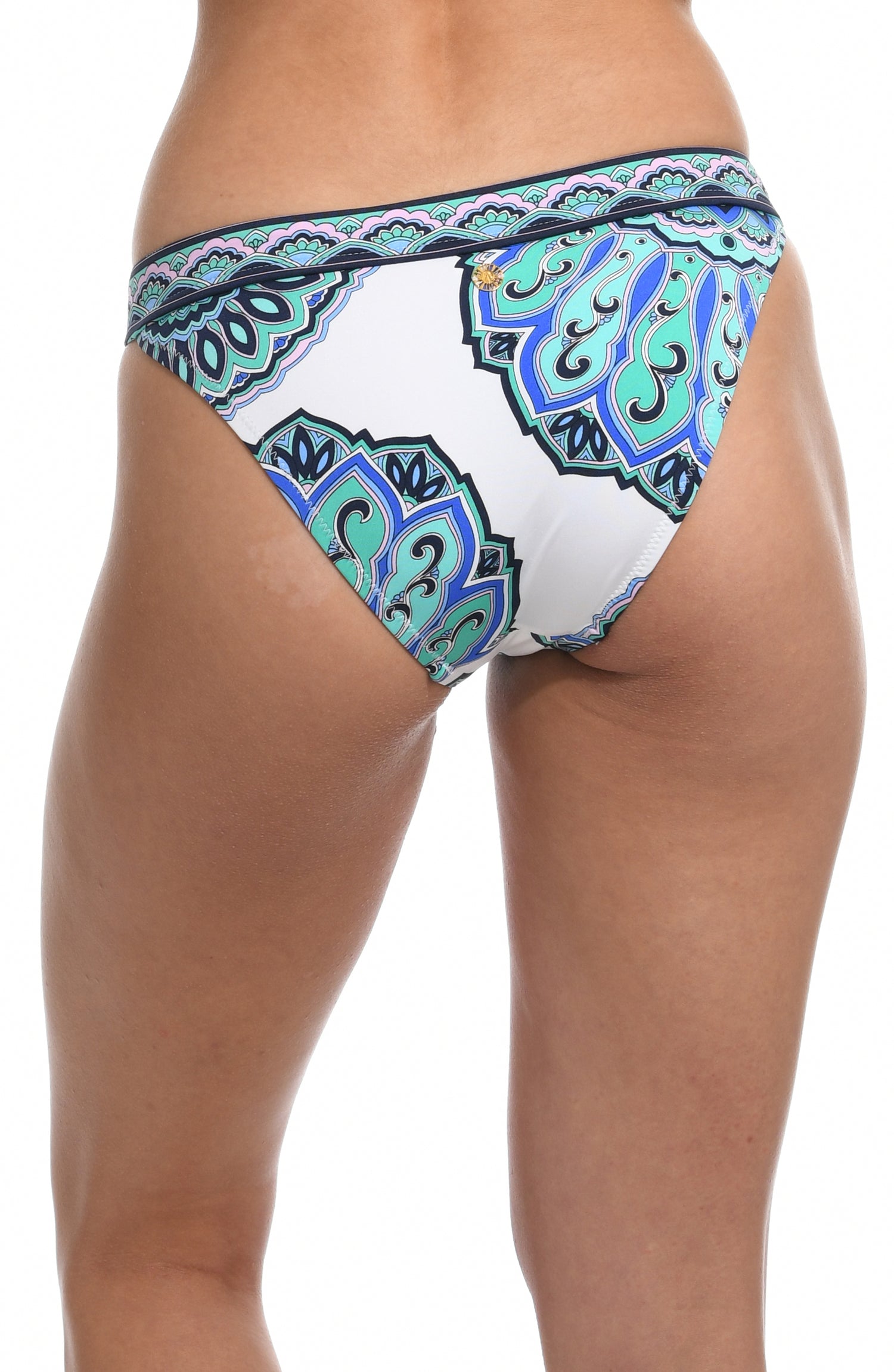 Model is wearing a white french cut swimsuit bottom with shades of a blue medallion all over print from our Mellow Medallion collection.