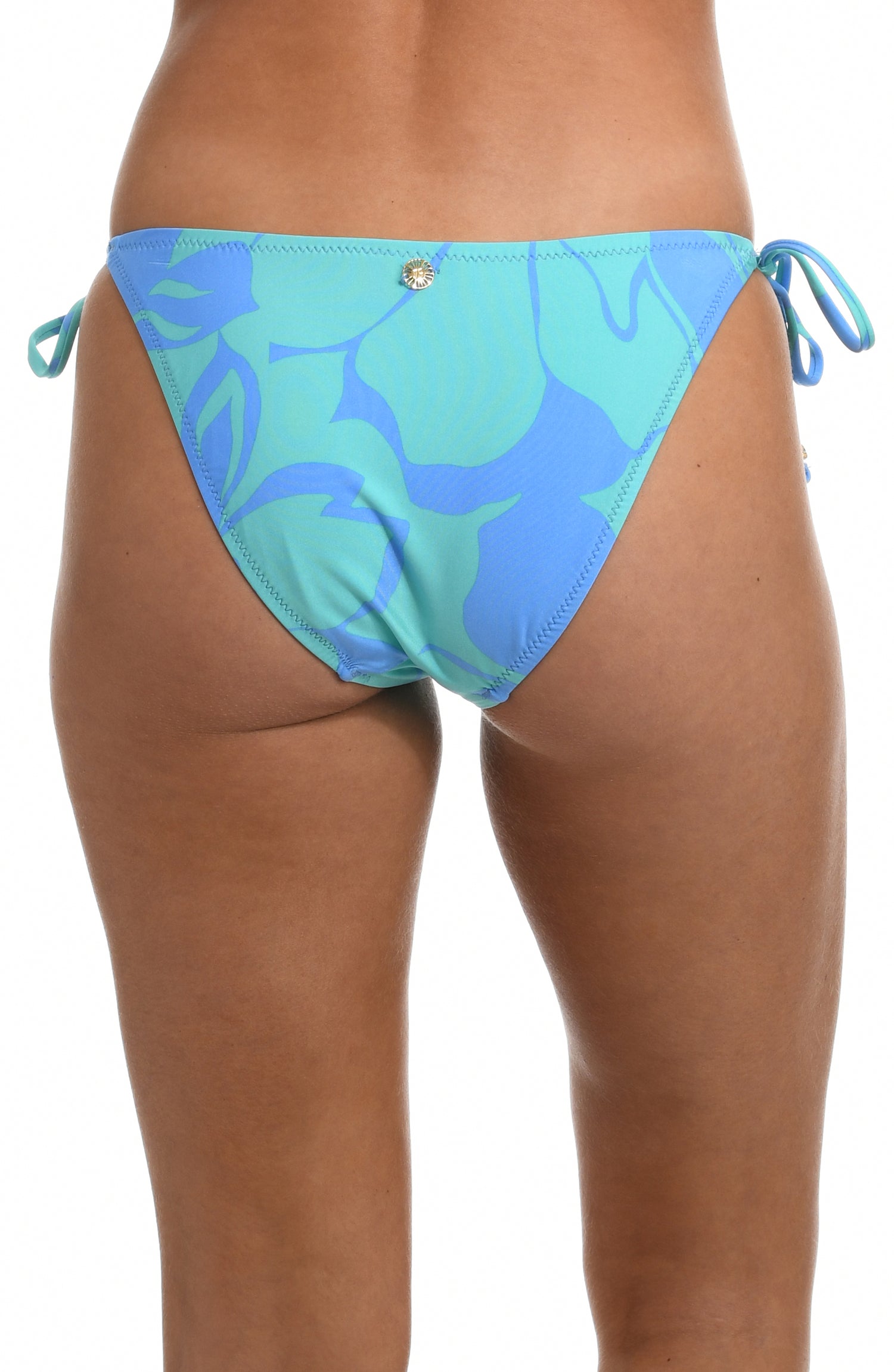 Model is wearing a sky blue and seafoam green multicolored tropical printed side tie hipster swimsuit bottom from our Fresh Blooms collection.