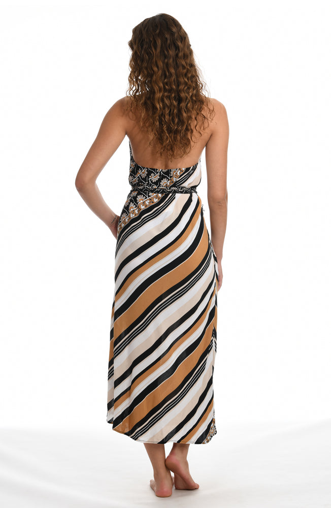 Model is wearing a retro inspired printed maxi dress swimsuit cover up with diagonal stripes and floral medallions in brown earthy tones from our 70's Stripe collection.