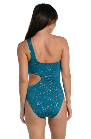 
            
                Load image into Gallery viewer, Model is wearing a solid teal colored cutout one shoulder one piece swimsuit from our Zodiac collection.
            
        