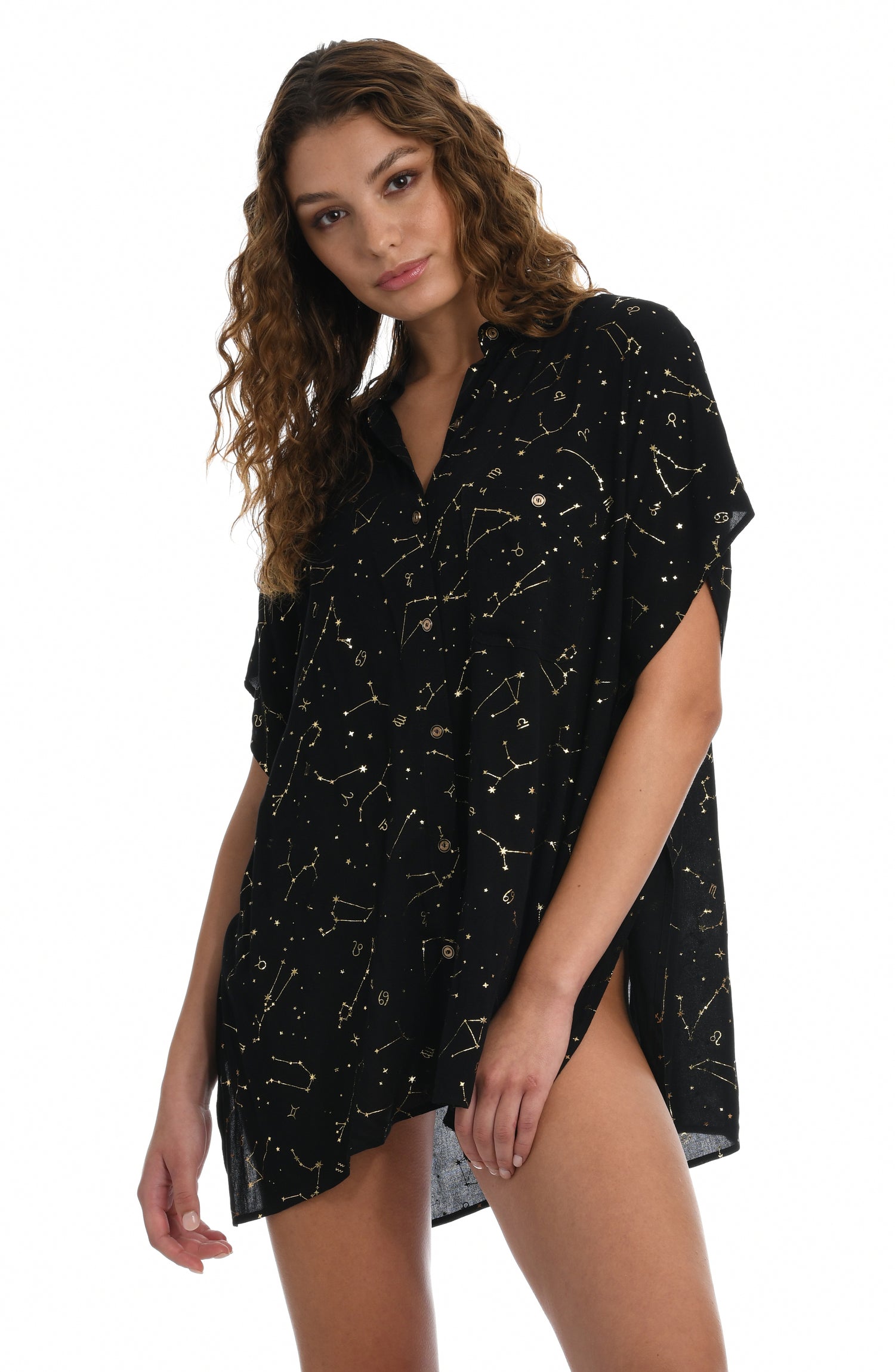 Model is wearing a solid black colored resort button down cover up shirt from our Zodiac collection.