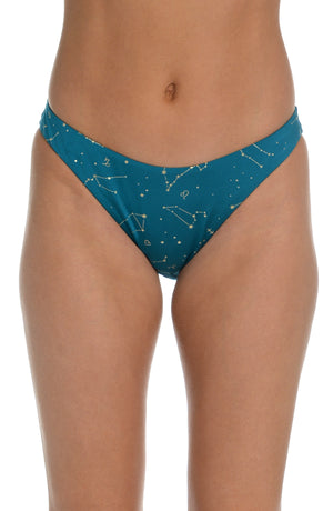 Model is wearing a solid teal colored french cut bikini bottom from our Zodiac collection.