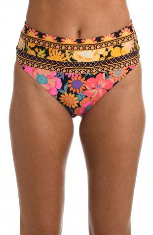 Model is wearing a yellow and pink multicolored retro inspired flower printed high waist swimsuit bottom from our Flower Power collection.