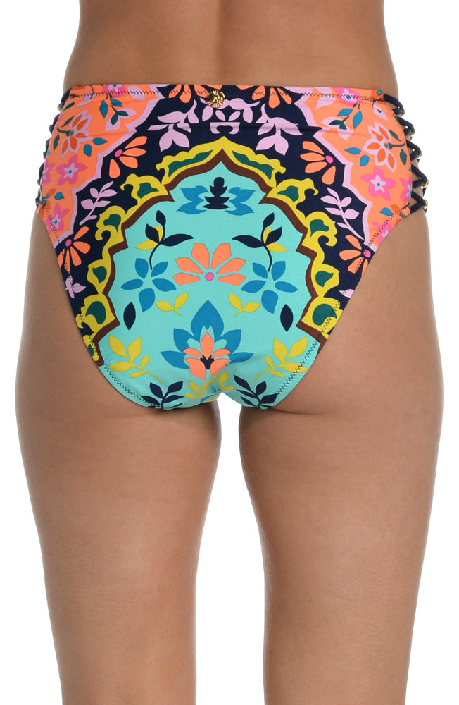 Model is wearing a multicolored bohemian printed high waist bikini bottom from our Flora-Block collection.