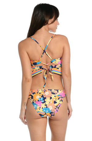 
            
                Load image into Gallery viewer, Model is wearing a bright multicolored floral swirl printed over the shoulder midkini top from our Love Swirl collection.
            
        