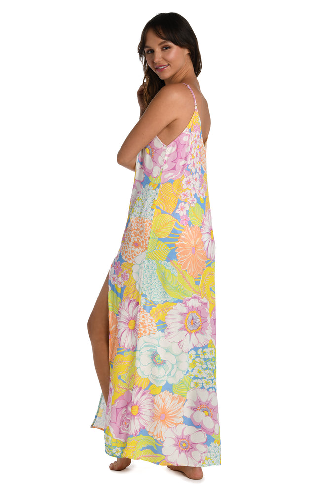 Model is wearing a light pastel multicolored floral printed maxi dress cover up from our Botanical Bliss collection.