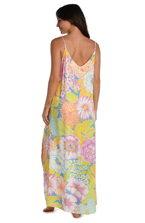 Model is wearing a light pastel multicolored floral printed maxi dress cover up from our Botanical Bliss collection.