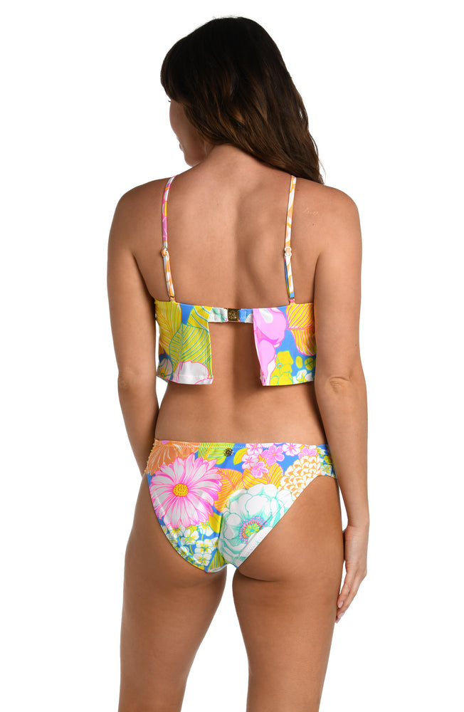 Model is wearing a light pastel multicolored floral printed high neck midkini top from our Botanical Bliss collection.
