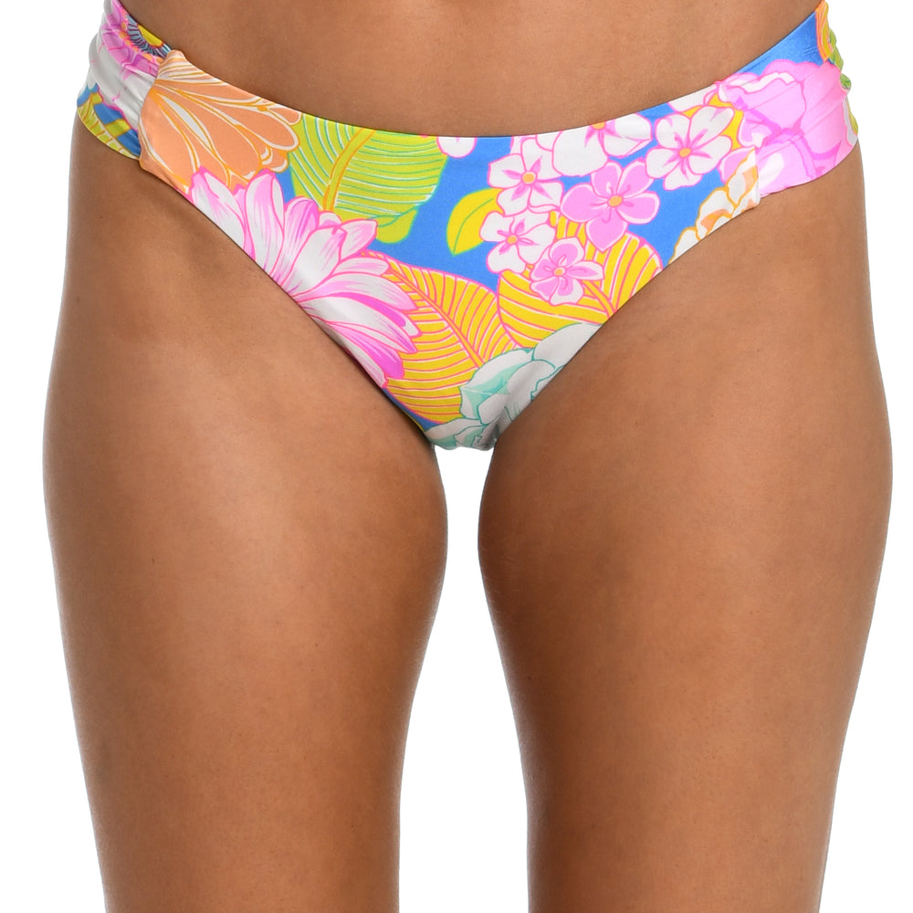 Model is wearing a light pastel multicolored floral printed side shirred hipster bikini bottom from our Botanical Bliss collection.