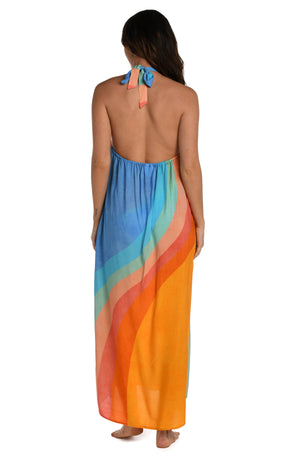 Model is wearing an orange and blue multicolored retro printed maxi dress cover up from our Mod Block collection.