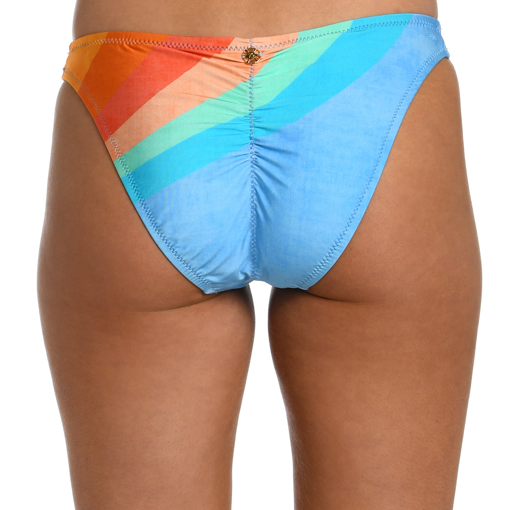 
                  
                    Model is wearing an orange and blue multicolored retro printed french cut bikini bottom from our Mod Block collection.
                  
                