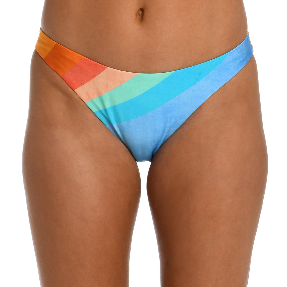 
                  
                    Model is wearing an orange and blue multicolored retro printed french cut bikini bottom from our Mod Block collection.
                  
                