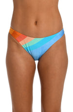 Model is wearing an orange and blue multicolored retro printed french cut bikini bottom from our Mod Block collection.