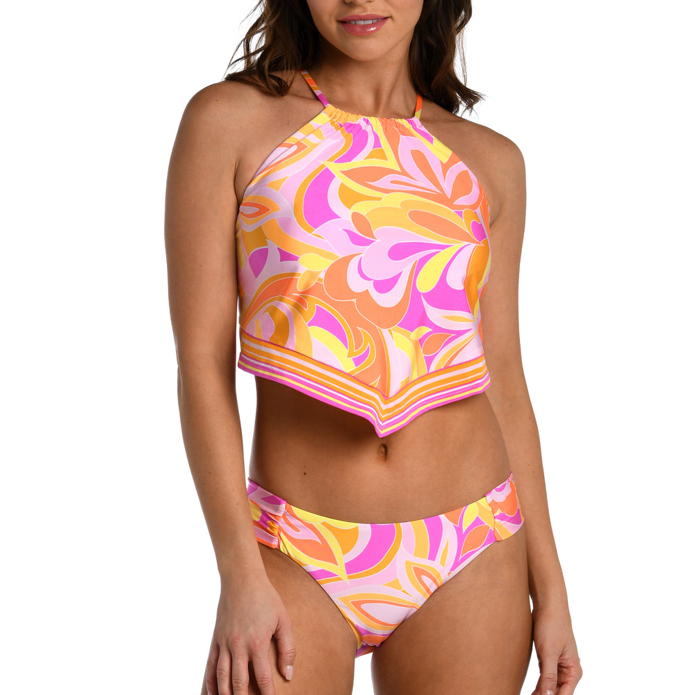 
                  
                    Model is wearing a pink, white, and orange multicolored retro printed high neck midkini top from our Retro Swirl collection.
                  
                