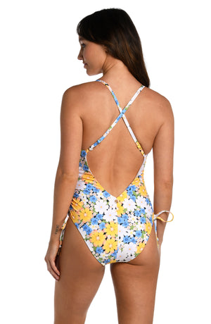 Model is wearing a multicolored daisy printed plunge one piece from our Daisy Daze collection.