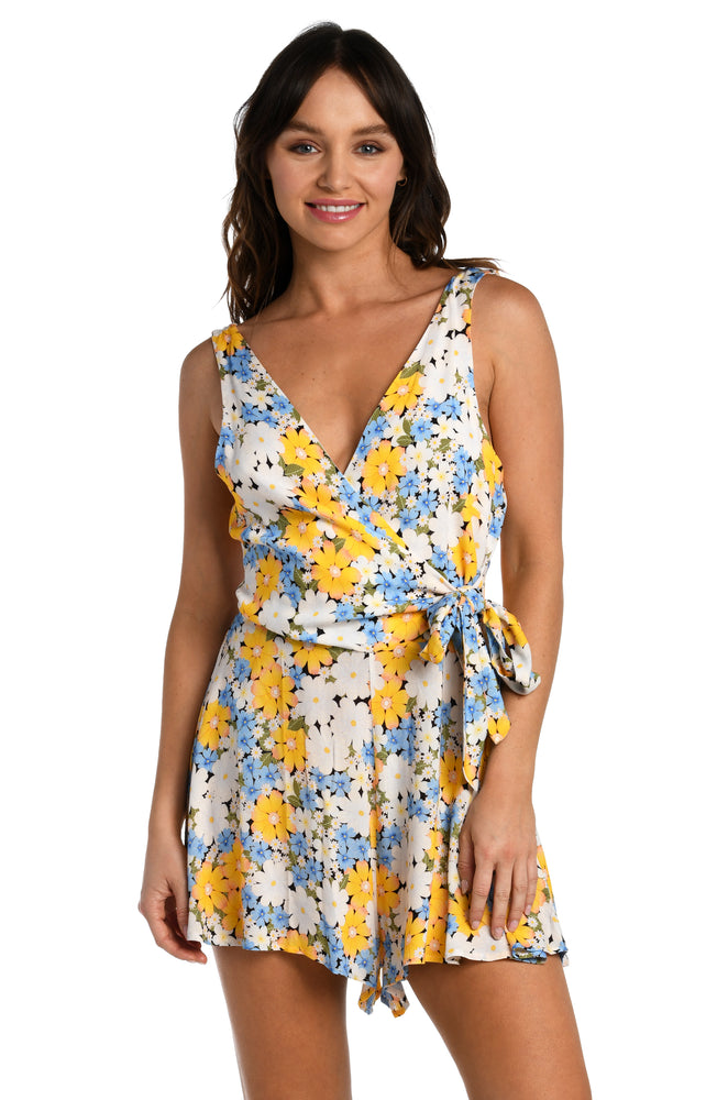 
            
                Load image into Gallery viewer, Model is wearing a multicolored daisy printed plunge romper cover up from our Daisy Daze collection.
            
        
