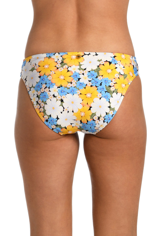 Model is wearing a multicolored daisy printed side shirred hipster bikini bottom from our Daisy Daze collection.