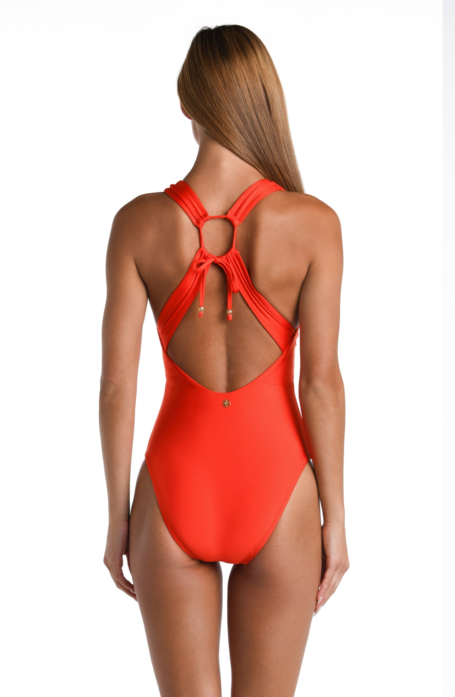 Model is wearing a solid vibrant Flame colored Keyhole V-Plunge One Piece