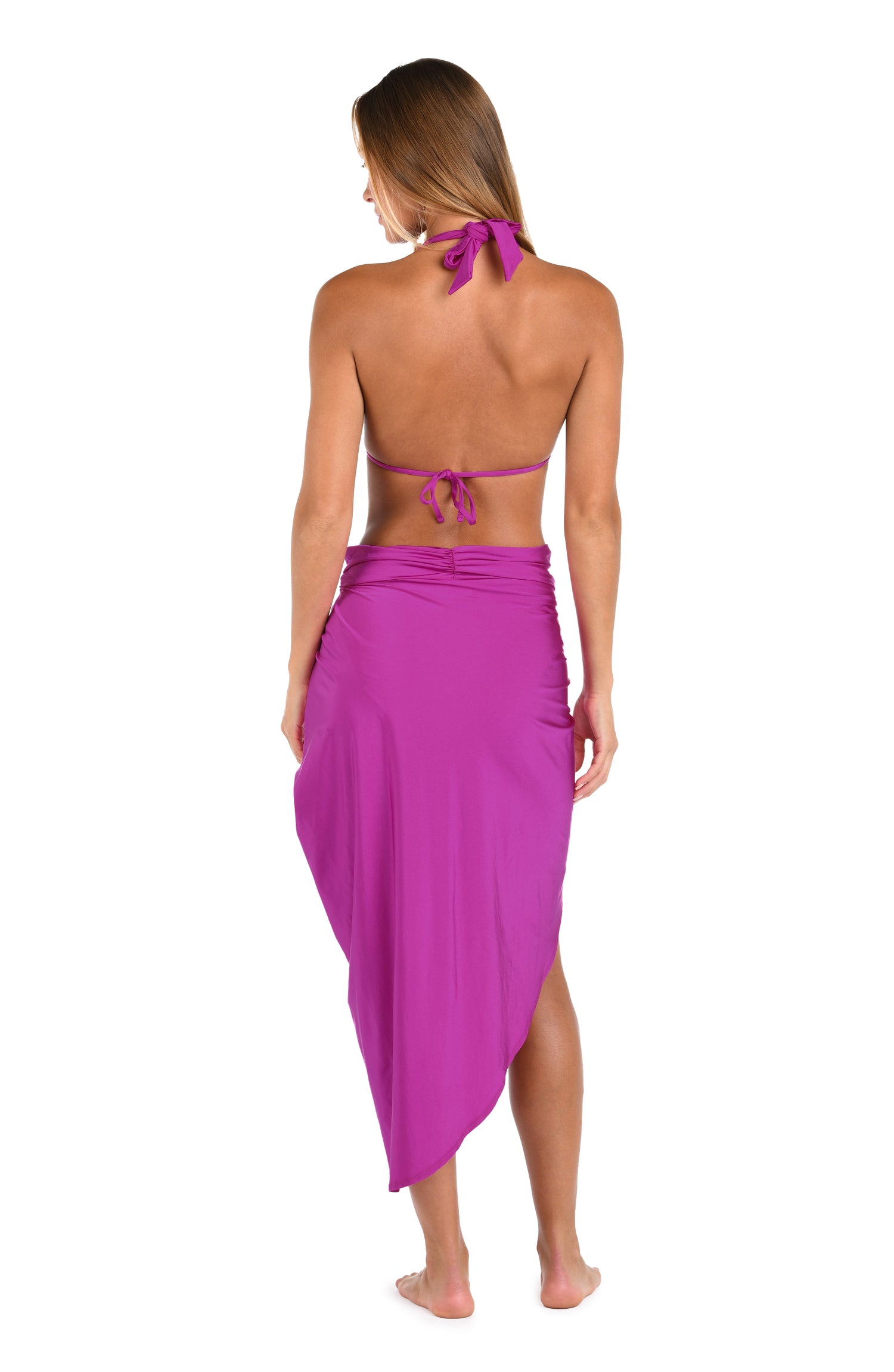 Back image of model wearing a Sunshine 79 Sunshine Solids Pull-On Faux Pareo Cover Up in Bright Violet.