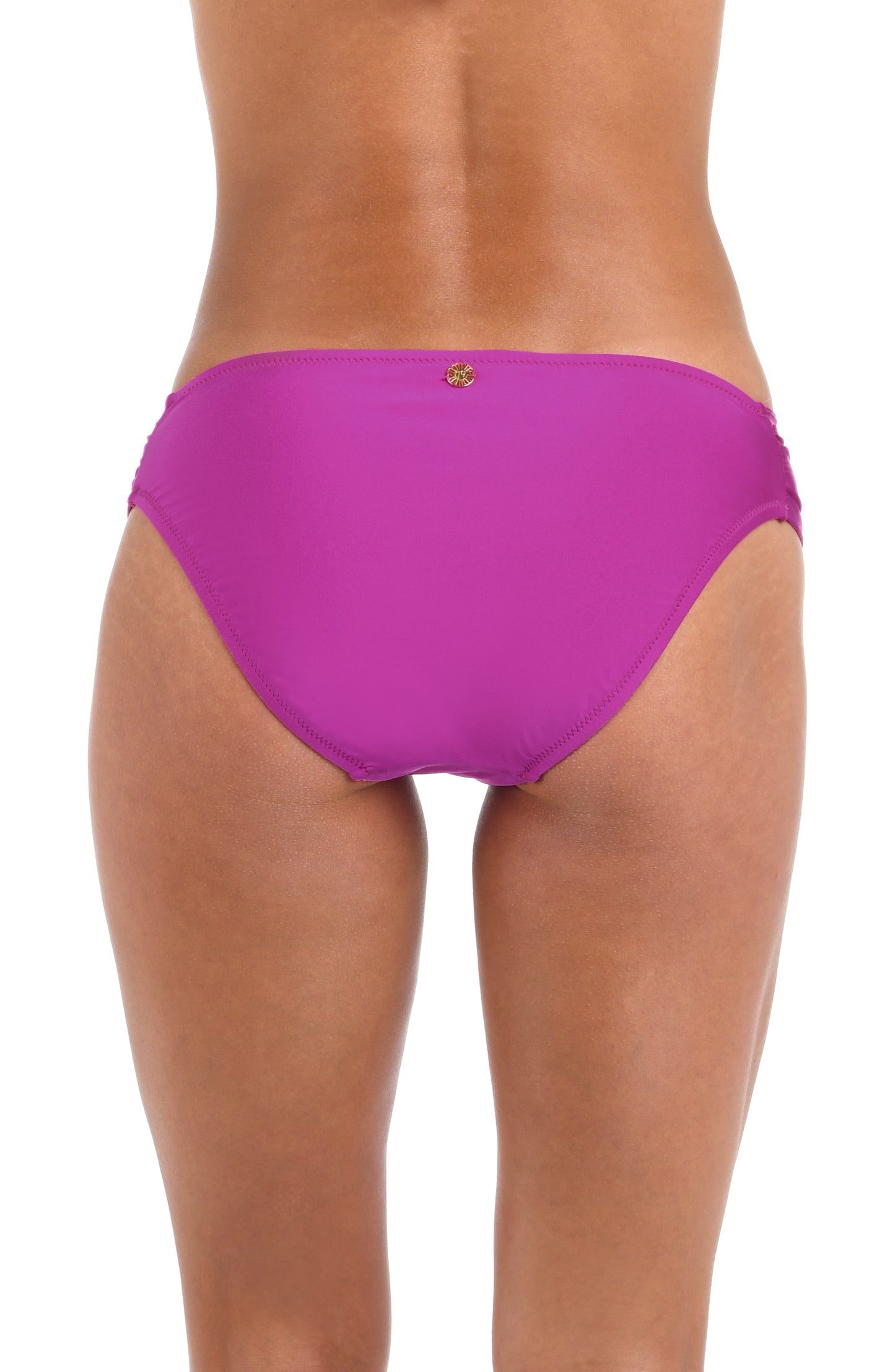 Back image of model wearing a Sunshine 79 Sunshine Solids Side Shirred Hipster Bottom in Bright Violet.