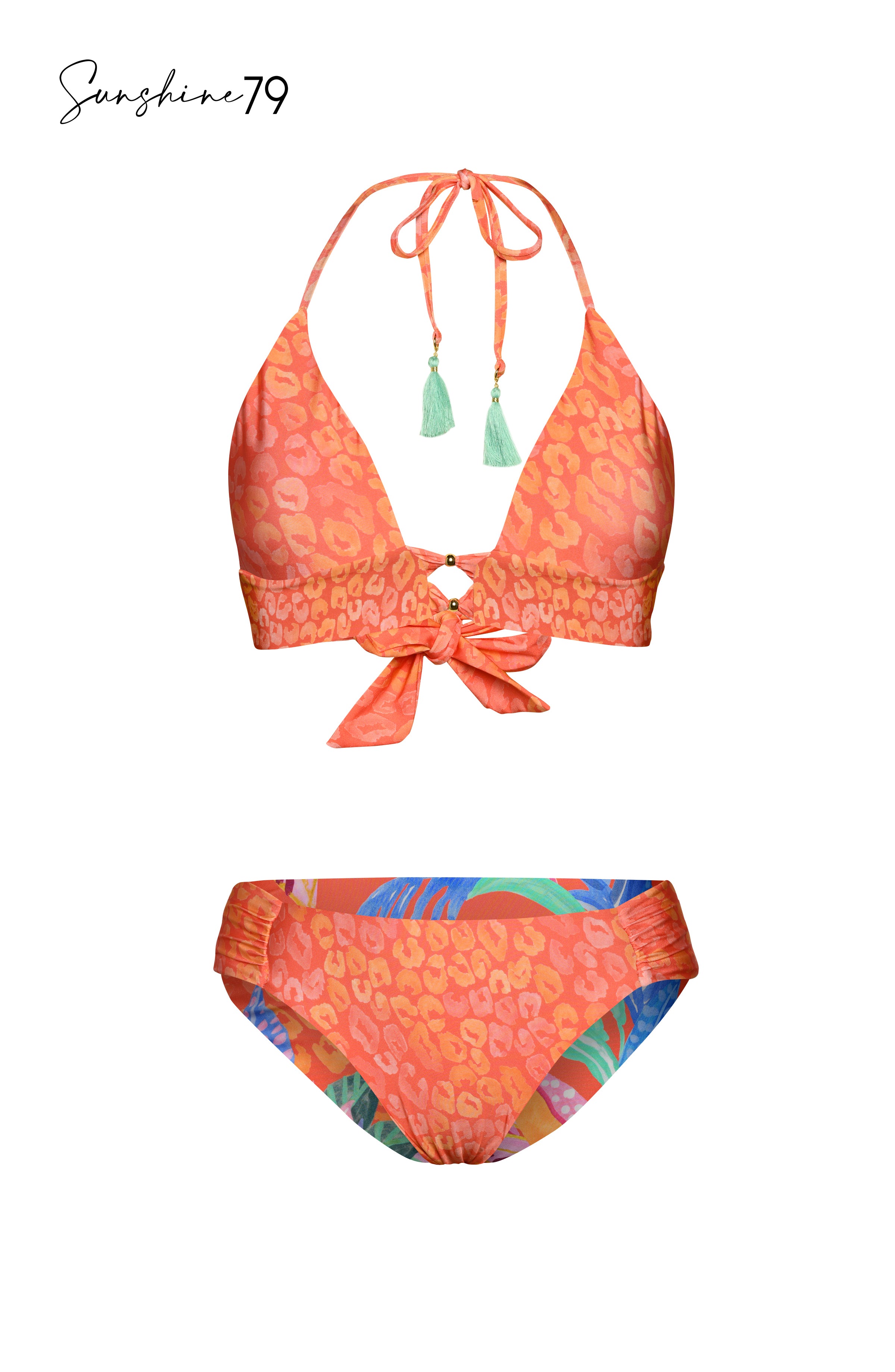 Model is wearing an orange multicolored tropical printed reversible side shirred hipster bikini bottom from our Sunshine 79 brand.