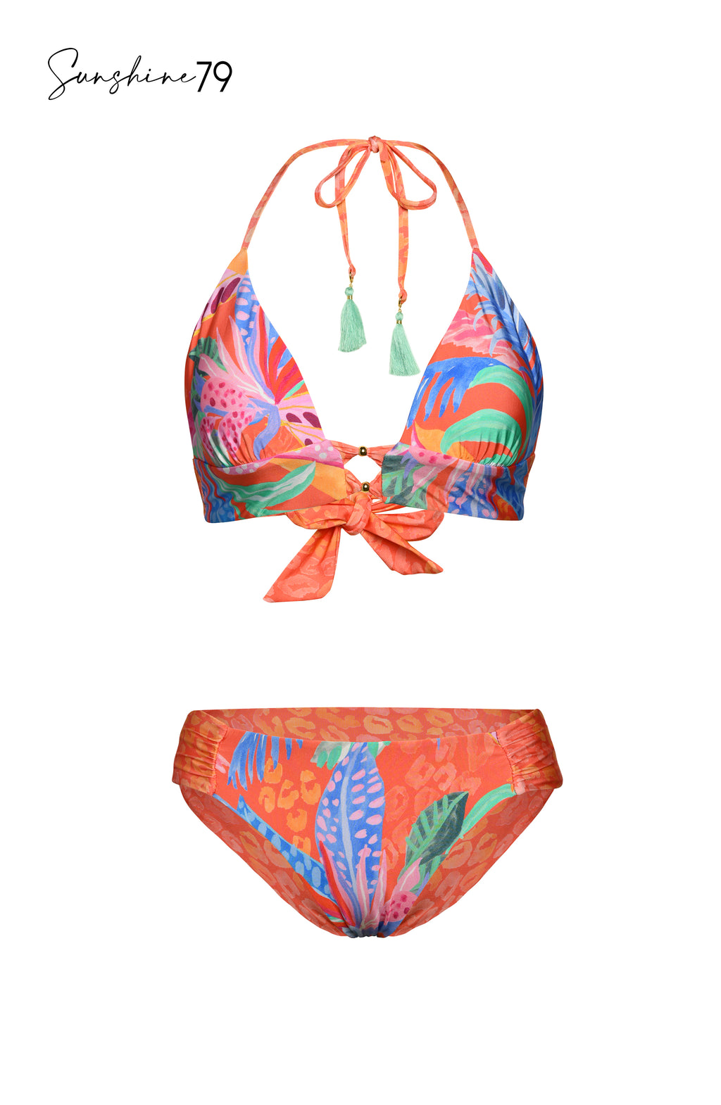Model is wearing an orange multicolored tropical printed reversible side shirred hipster bikini bottom from our Sunshine 79 brand.