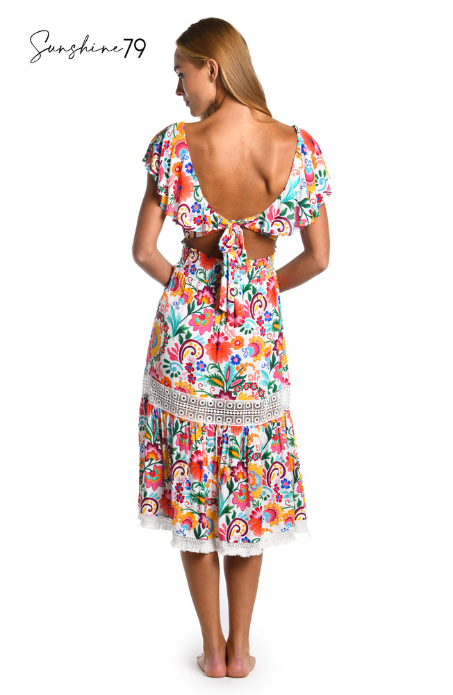 Model is wearing a multicolored spanish inspired printed midi dress cover up from our Sunshine 79 brand.