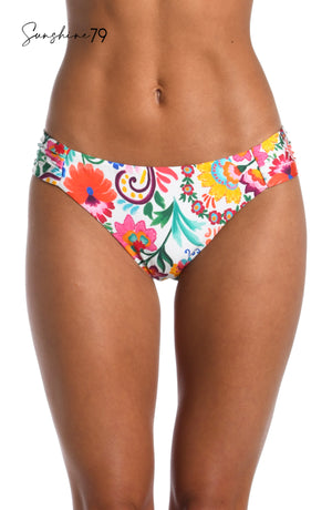Model is wearing a multicolored spanish inspired printed side shirred hipster bikini bottom from our Sunshine 79 brand.