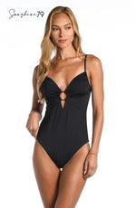 Model is wearing a solid black colored over the shoulder keyhole one piece from our Sunshine 79 brand.